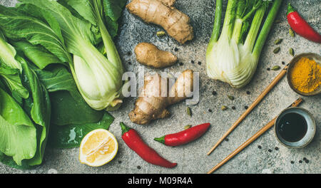 Flat-lay of Asian cuisine ingredients over concrete background, copy space Stock Photo