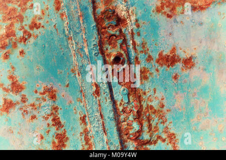 Old, rusty, wooden, door with key lock. Close-up vintage image with film grain. Stock Photo
