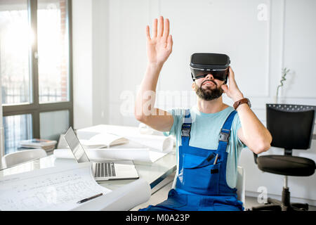 Foreman using vr glasses to imagine projected environment Stock Photo