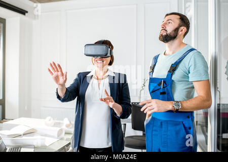 Senior woman using vr glasses to imagine or design a project Stock Photo