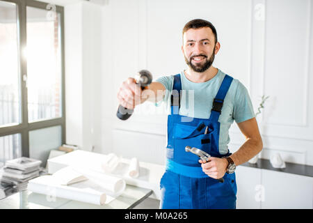 Repairman in the office Stock Photo