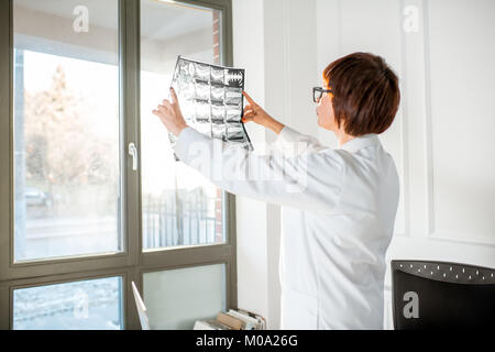 Woman working with x-ray in the office Stock Photo
