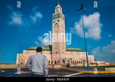 Casablanca, Morocco - 14 January 2018 : tourist walking face to Hassan II mosque Stock Photo
