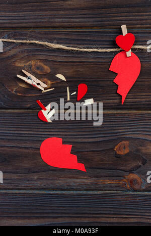 Broken heart breakup collection and divorce icon. Red paper shaped as a torn love , health care problems due to illness. Broken love concept. Stock Photo
