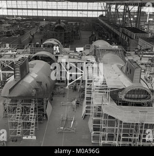 1950s, historical, commerical aircraft being built or assembled inside a large aerospace factory or hangar near London Airport, England, UK. Stock Photo