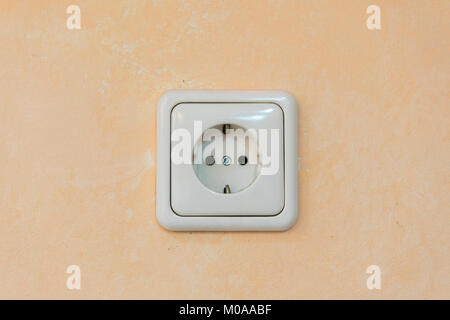 White rosette on a beige wall Stock Photo
