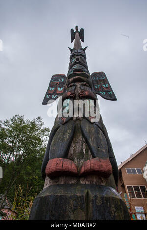 Tall wooden totem pole in Alaska Stock Photo