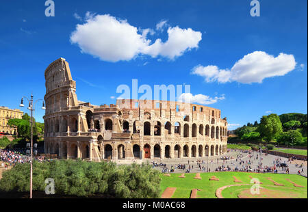 Rome, Italy. View of Colosseum from the Palatine Hill on a sunny day with blue sky and clouds.