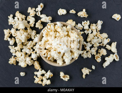Popcorn in a wooden bowl. Stock Photo