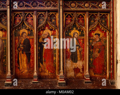 S end of C15th rood screen in St Agnes' Church, Cawston: Flemish paintings of saints (L-R) Jude, Matthew wearing spectacles, Matthias & John Schorne. Stock Photo