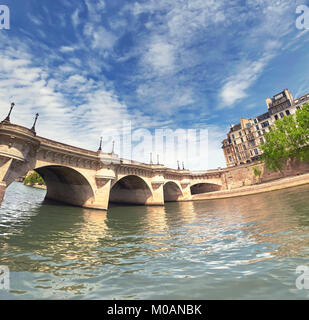 Pont Neuf bridge on Seine river in Paris, France, on a bright sunny day, panoramic image. Stock Photo
