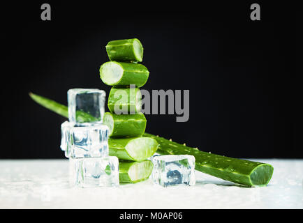 Aloe Vera and Ice Cubes on Dark Background Stock Photo