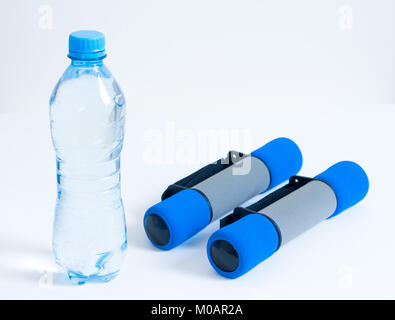 water bottle and exercise equipment isolated on white background Stock Photo