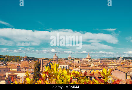 Autumn in Rome, Italy. Bird view to the side of Capitol Hill with roofs and churches of the ancient city on the bright day. Toned image, space for you Stock Photo