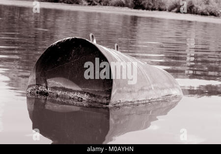 Industrial barrel thrown into the lake for garbage and make a big pollution. Water pollution. Climate changes. Industry pollution. Waste, garbage Stock Photo