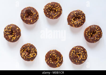 Eight 8 Tesco Festive Mini Doughnuts in a ring isolated on white background Stock Photo