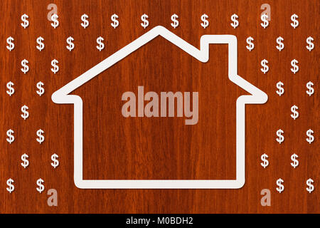 Paper house in rain of dollars on wooden background, money concept. Abstract conceptual image Stock Photo