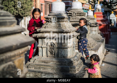 children at Kaathe Swyambhu Shee Temple: Gha: Chaitya Stock Photo