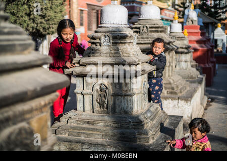 children at Kaathe Swyambhu Shee Temple: Gha: Chaitya Stock Photo