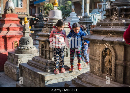 children at Kaathe Swyambhu Shee Temple: Gha: Chaitya Stock Photo