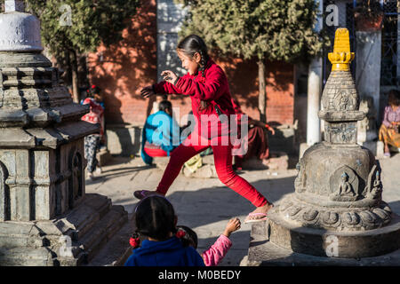 children at Kaathe Swyambhu Shee Temple: Gha: Chaitya Stock Photo