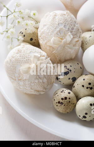 Plate  with decorated  Easter eggs in retro style.  Focus on the  Easter eggs . Stock Photo