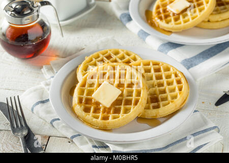 Brown Hot Freezer Waffles with Butter and Maple Syrup Stock Photo