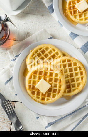 Brown Hot Freezer Waffles with Butter and Maple Syrup Stock Photo
