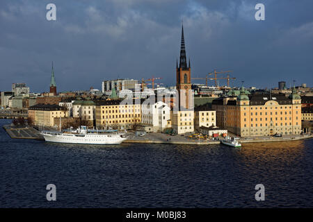 Stockholm, Sweden - November 27, 2016: View to Riddarholmen and Gamla Stan in an autumn day. Gamla Stan, the Old Town, is one of the largest and best  Stock Photo