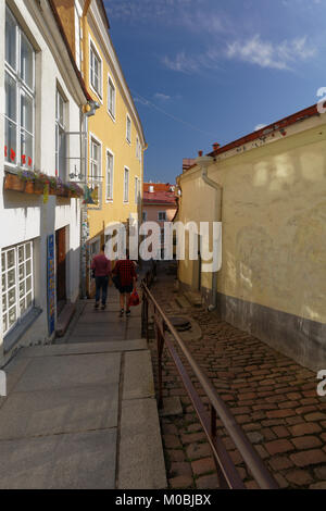 Tallinn, Estonia - August 20, 2016: People on the narrow street of Old Town. The Old Town is one of the best preserved medieval cities in Europe and i Stock Photo