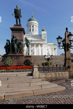 Helsinki, Finland - August 21, 2016: Statue of Russian Emperor Alexander II on Senate square against Helsinki Cathedral. The statue, erected in 1894,  Stock Photo