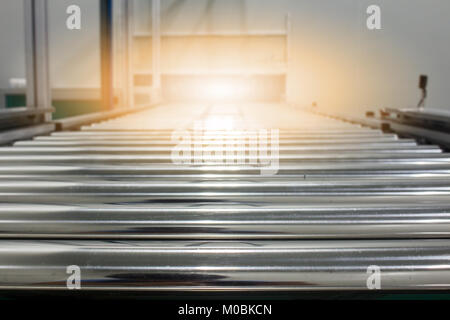 The conveyor chain, and conveyor belt on production line set up in clean room area. Stock Photo