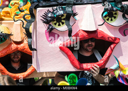 Atlanta, GA, USA - September 23, 2017:  Men wearing huge handmade custom masks walk in the East Atlanta Strut festival parade on September 23, 2017 in Stock Photo