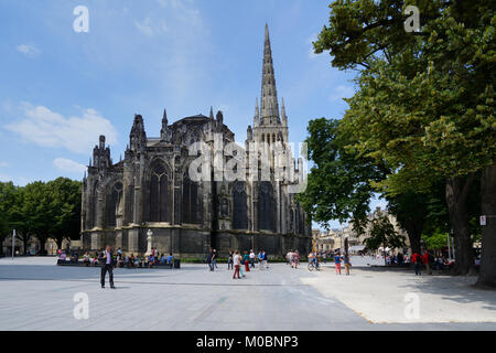 Bordeaux, France - June 27, 2013: People resting and walking in front of the St. Andrew Cathedral. The building is a national monument of France Stock Photo
