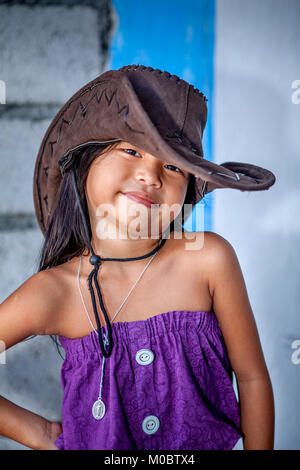 https://l450v.alamy.com/450v/m0btx4/a-cute-young-filipino-girl-models-her-purple-dress-and-brown-leather-m0btx4.jpg