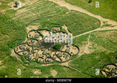 UGANDA, Karamoja, Kotido, karamojong pastoral tribe, aerial view of typical housing cluster Manyata, a homestead with huts and cattle ground, the wooden fencing is a protection from hostile tribes and cattle raiders Stock Photo