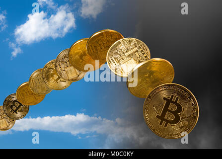 Bitcoin coins rising and falling from the sky Stock Photo