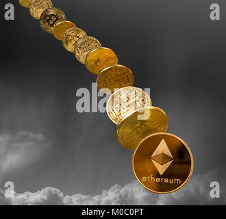 Ether and bitcoin coins dropping from the sky Stock Photo