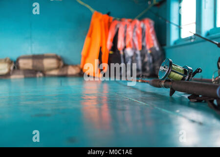 Fishing gear with life vest in the Garret on the boat Stock Photo