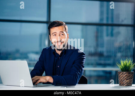 Business man or accountant working on laptop computer with business document Stock Photo