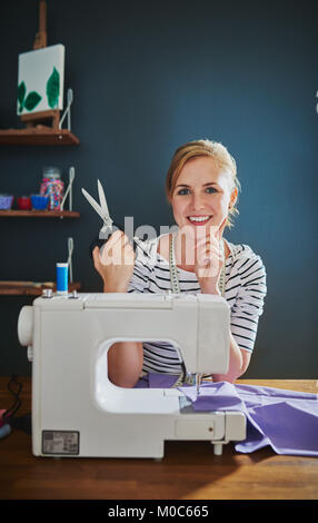 Portrait of female designer working at desk Stock Photo