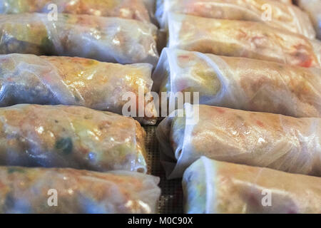 Closeup of pork spring rolls in rice wrappers Stock Photo