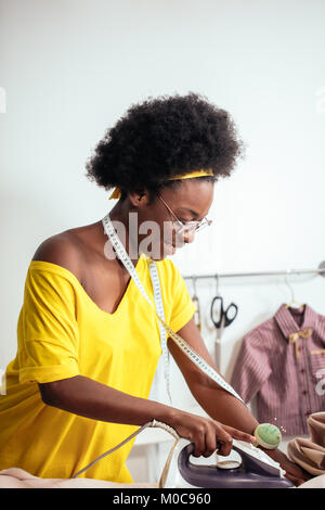 african Woman seamstress Ironing cloth