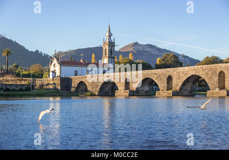 Church of Santo Antonio da Torre Velha and Roman bridge over Lima River in Ponte de Lima city, part of the district of Viana do Castelo, Portugal Stock Photo