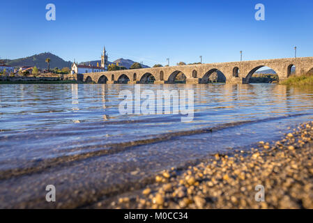 Church of Santo Antonio da Torre Velha and Roman bridge over Lima River in Ponte de Lima city, part of the district of Viana do Castelo, Portugal Stock Photo