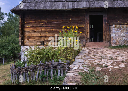 Traditional wooden cottage from 1882 in Ethnographic heritage park called Old Village Museum in Sirogojno village, Zlatibor region, Serbia Stock Photo