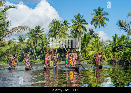 INDONESIA, IRIAN JAYA, ASMAT PROVINCE, JOW VILLAGE - MAY 23: Canoe war ceremony of Asmat people. Headhunters of a tribe of Asmat . New Guinea Island,  Stock Photo