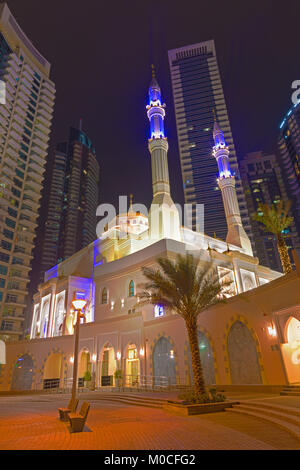 Dubai - The nightly promenade of Marina and the mosque. Stock Photo