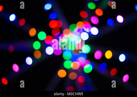 Abstract multicoloured Christmas lights on poles Stock Photo