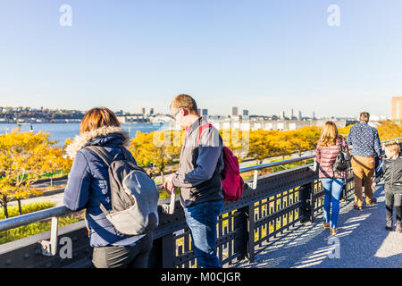 New York City, USA - October 27, 2017: View of Hudson River from highline, high line, urban in NYC with people tourists looking in Chelsea West Side b Stock Photo